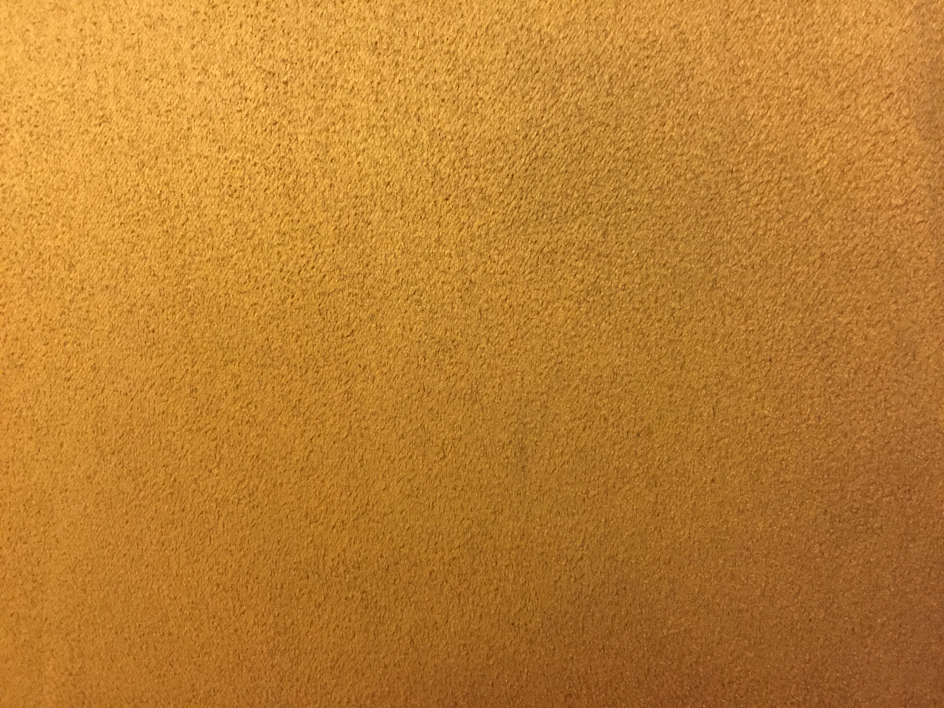 Close up of golden felt material texture