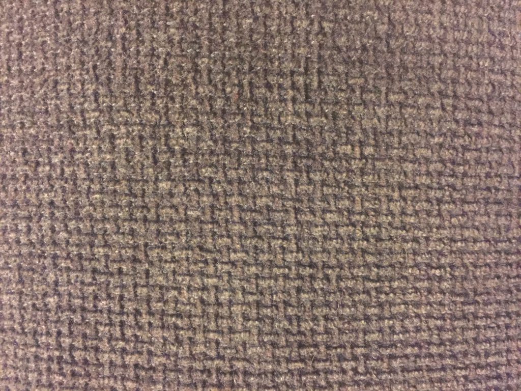 Deep brown upholstery fabric with pattern throughout