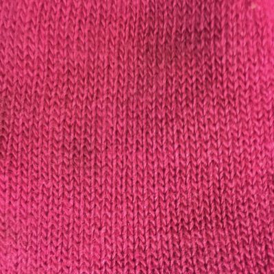 Loose pink knitted cotton fabric