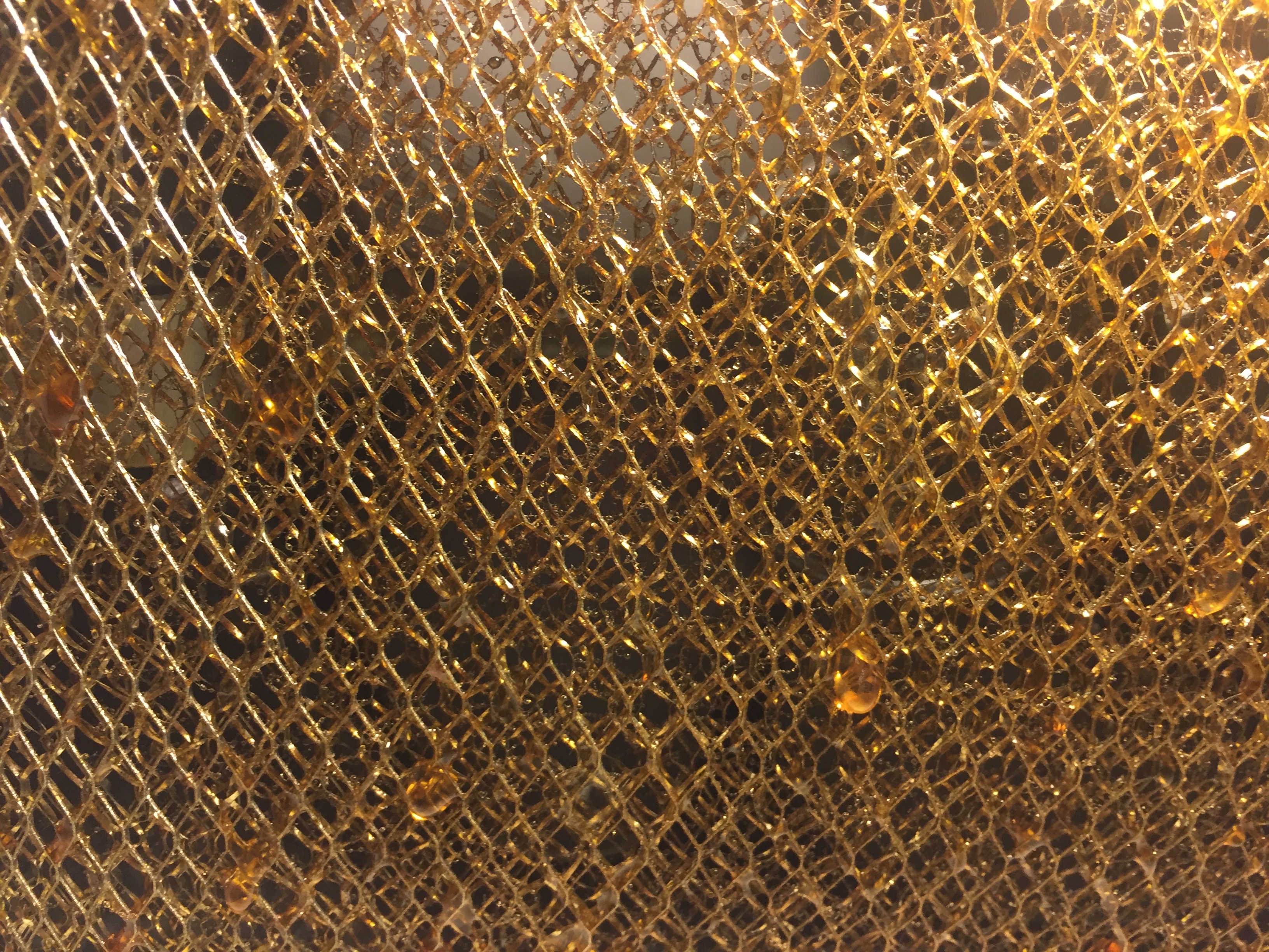 Layers of brass mesh with golden sap