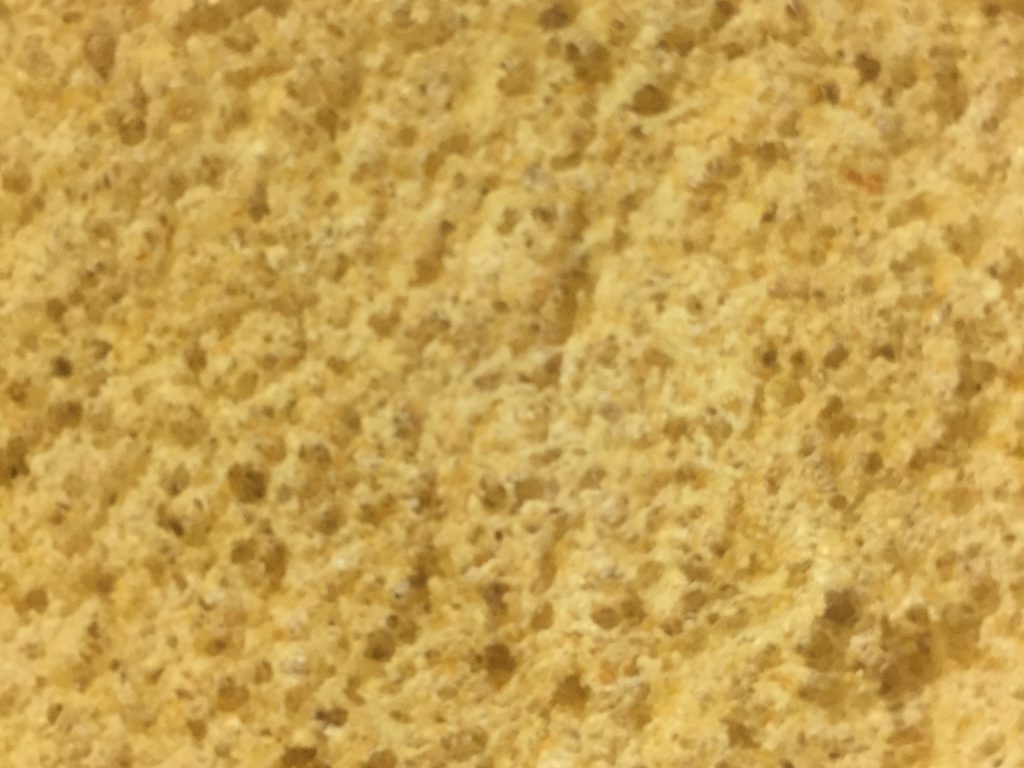 Texture of yellow sponge close up