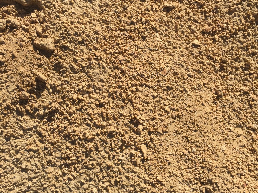 Dried gold brown earth with high contrast texture