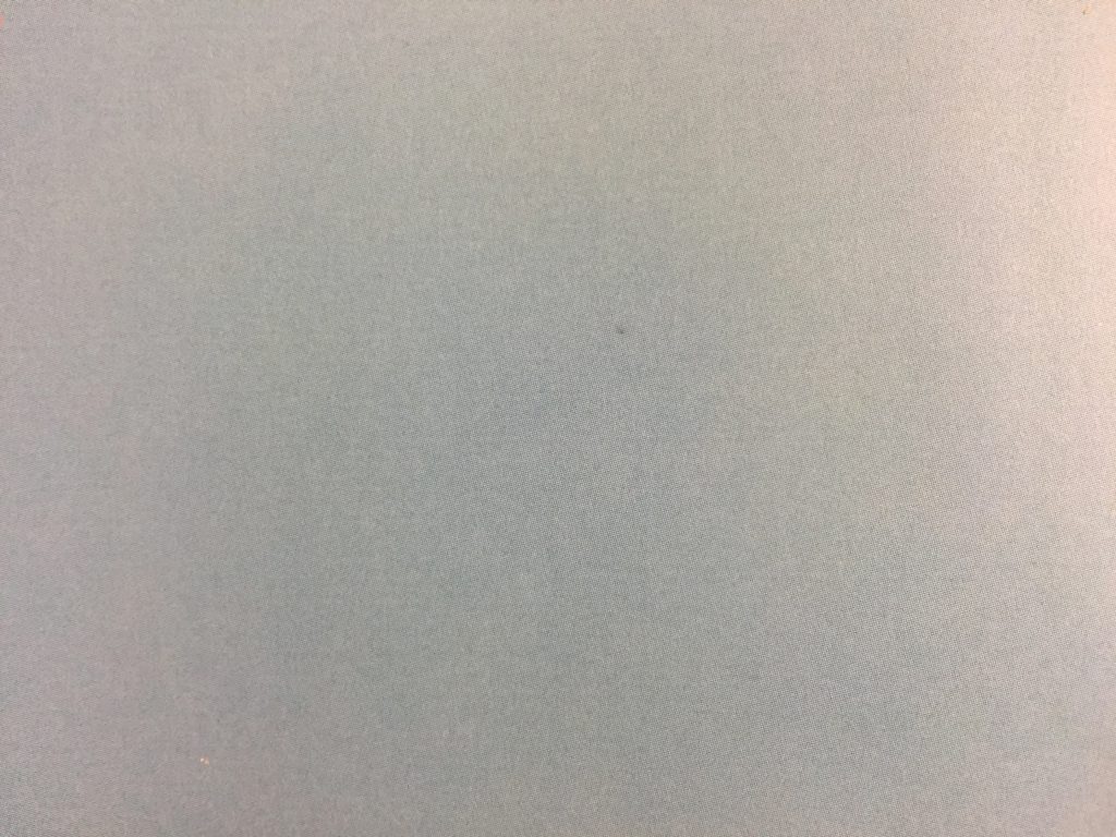Blue and light yellow paper with fine grain texture