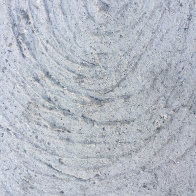 Light grey concrete swirl close up