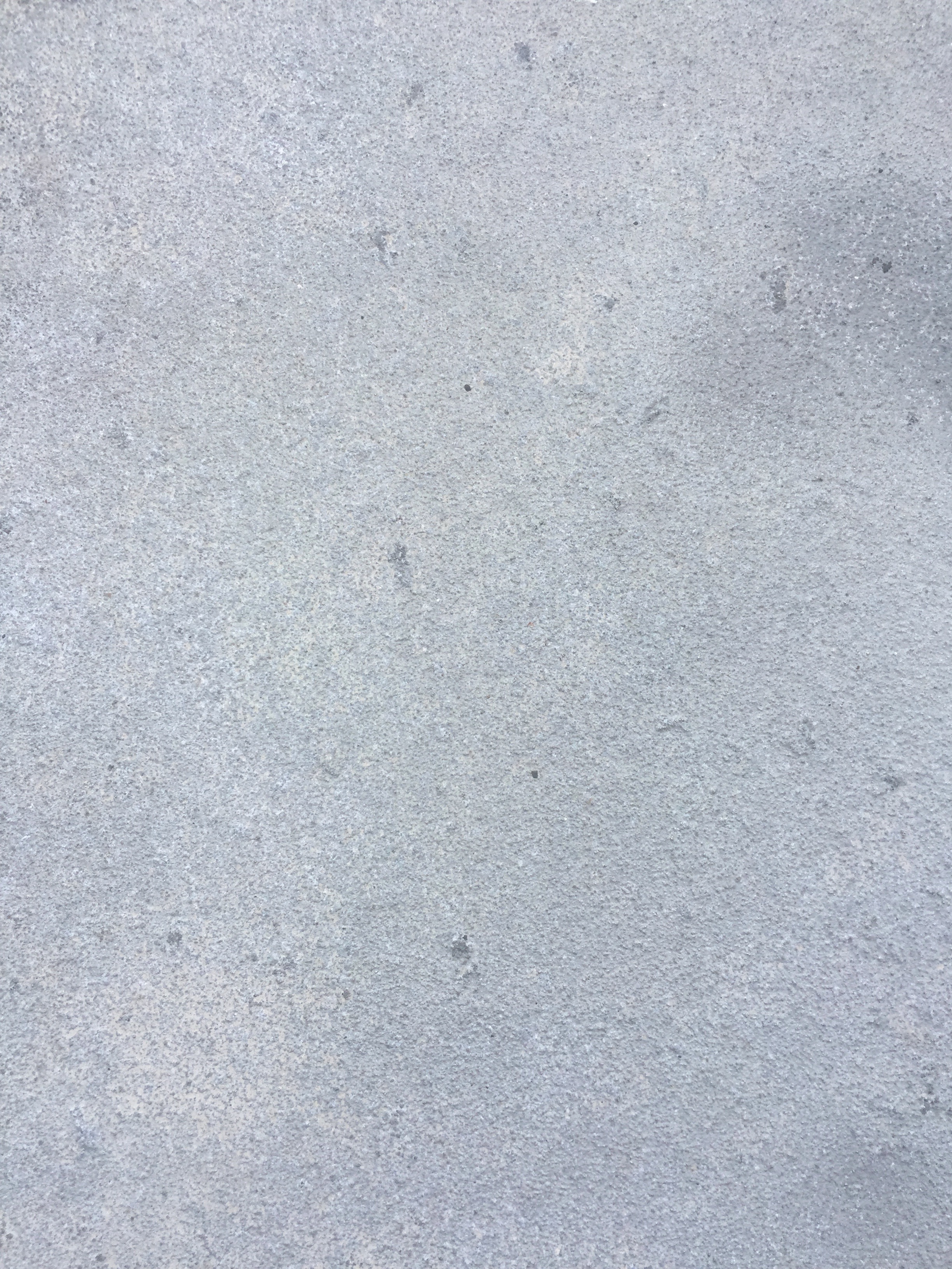 Light blue concrete wall with nice rough texture