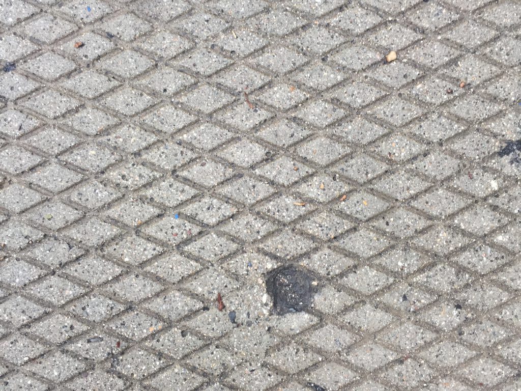 Concrete grid with light texture and tar