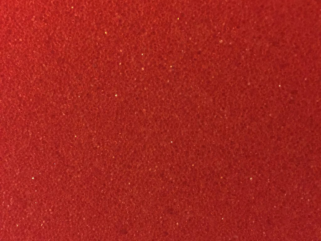 Deep red plastic with cell like pattern