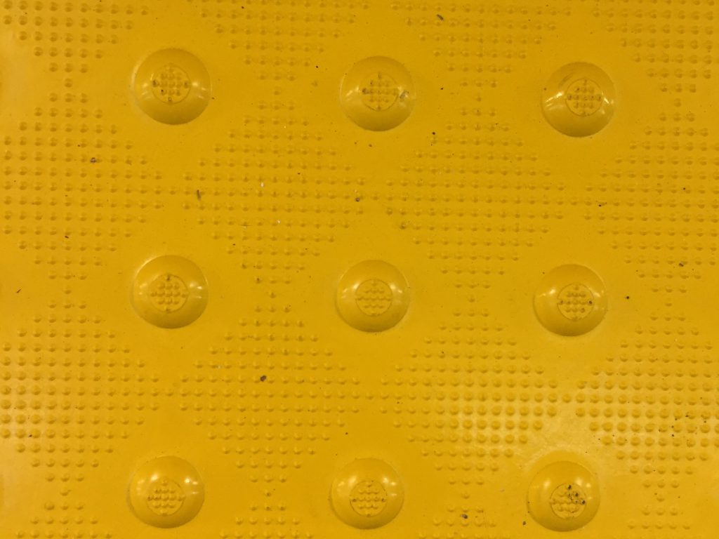 Mustard yellow plastic cross walk area