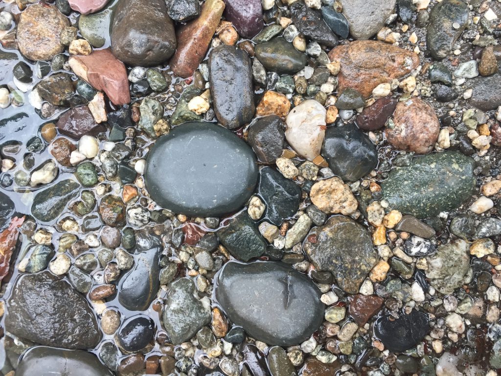Wet Shiny Pebbles and Stones