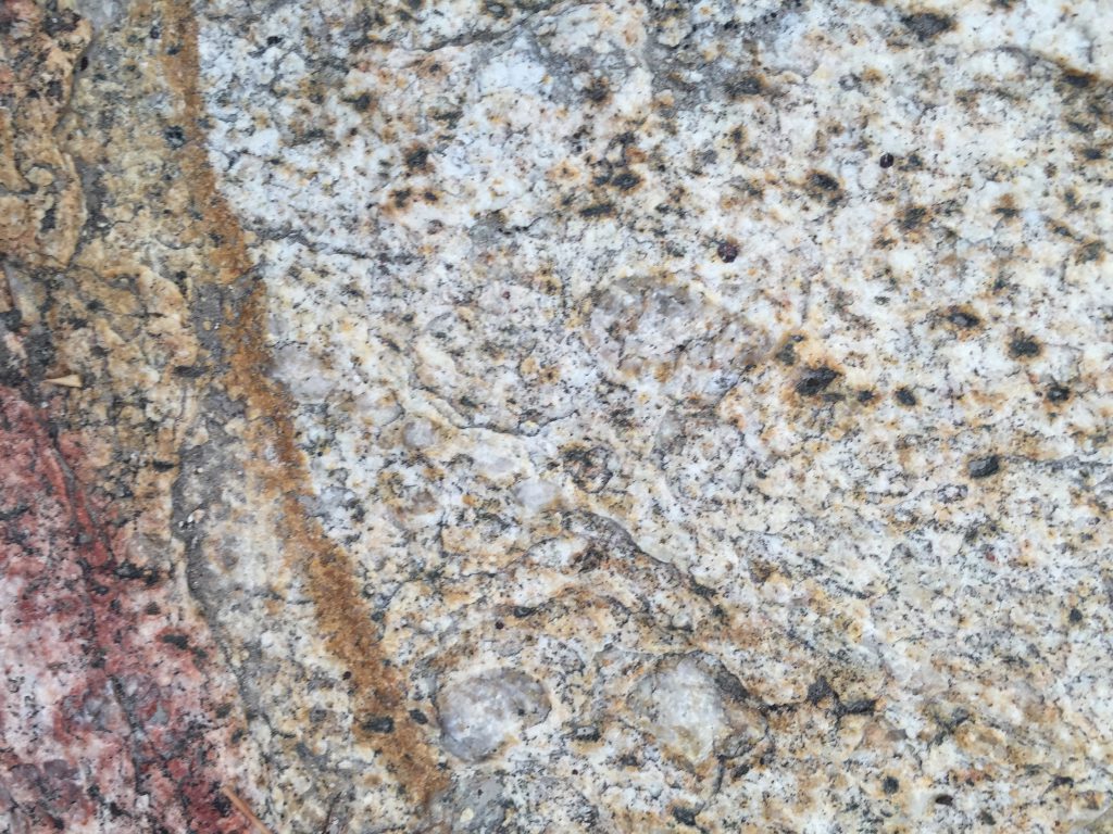 Close Up Granite with Red and Rust Color Stains