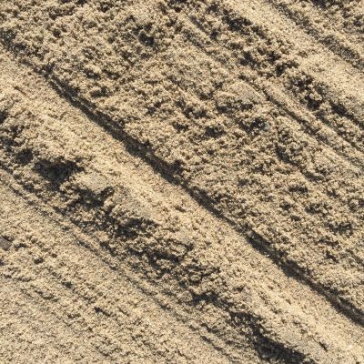 Crumbly light brown sand with ridges texture