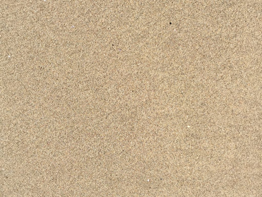 Light brown sand with tons of noise creating texture