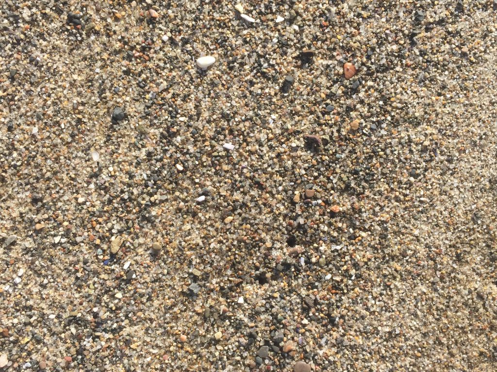 Coarse and rocky sand close up texture