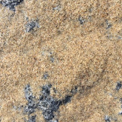 Wet sand over granite rock texture