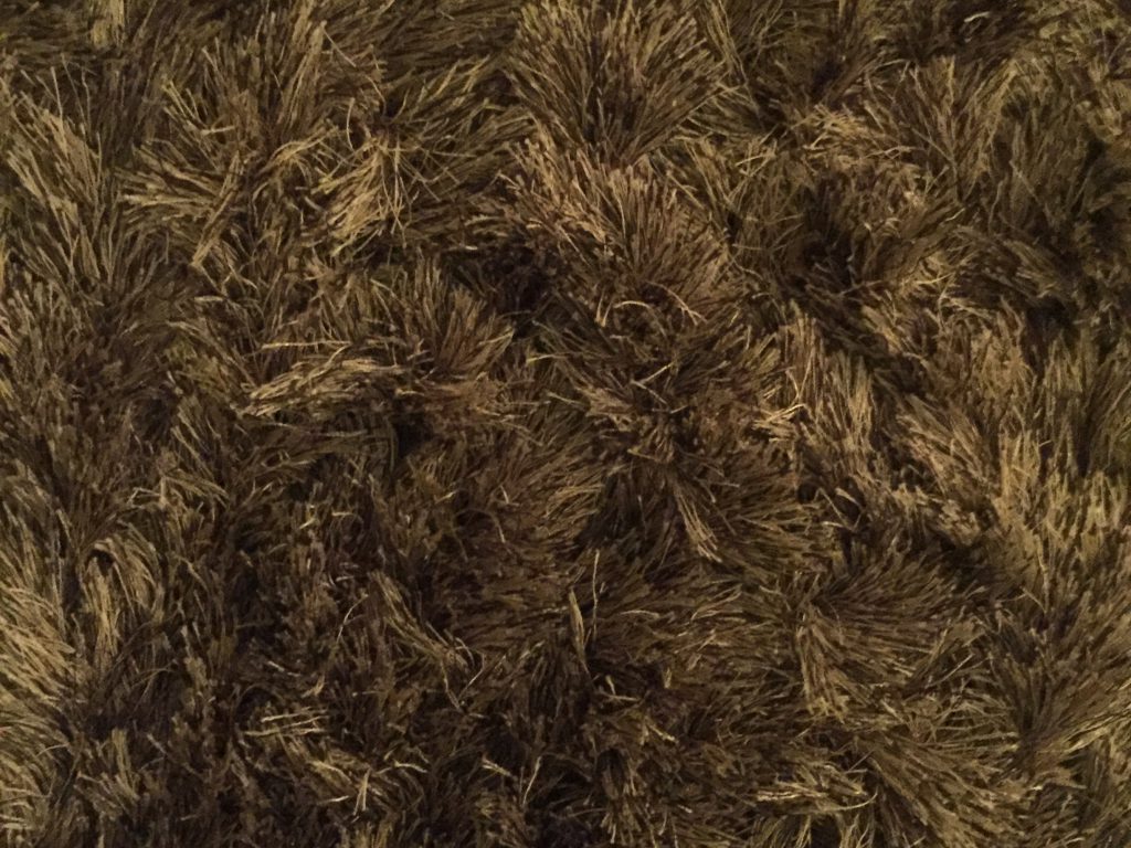 Golden brown shag carpet texture