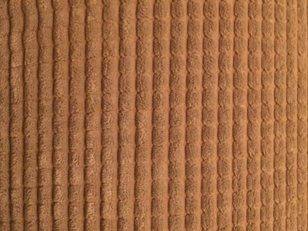 Light brown plush soft upholstery with vertical lines