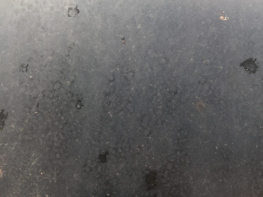 Dull grey with blotchy spots plastic texture