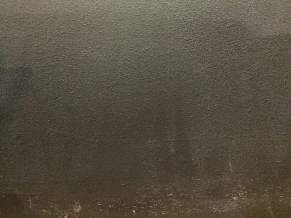 Dark grey paint on dry wall