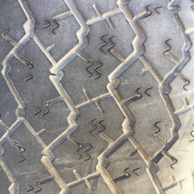 Close up of tire tread texture with wavy indents