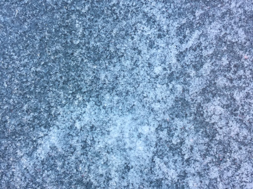 Click here to see High Resolution Image Close up of blue frosted window