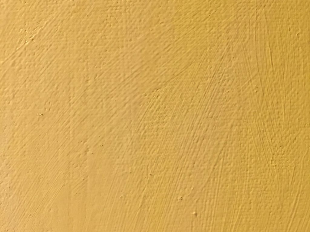 Canvas with light yellow acrylic paint brush strokes