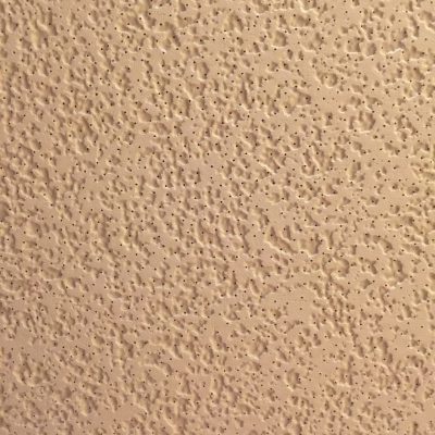 Pale yellow ceiling tile with pattern of tiny holes and shallow organic texture