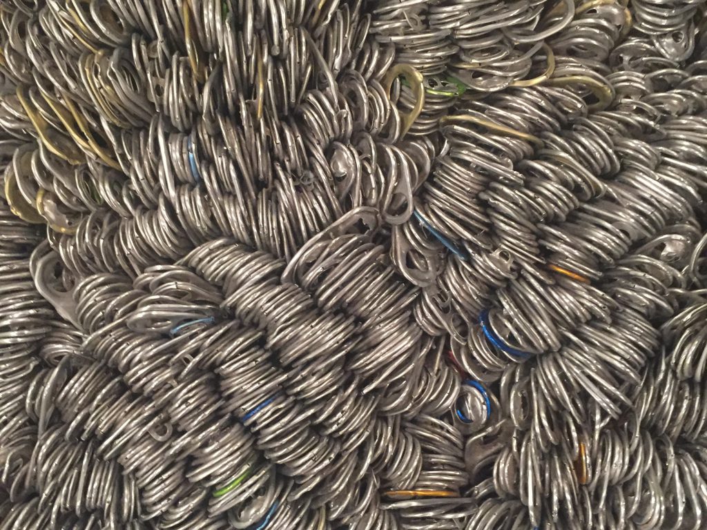 Metal can tabs in giant pile