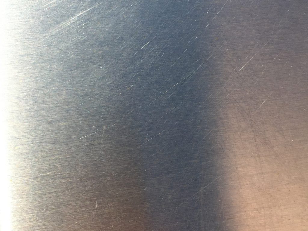 Light scratches on shiny metal