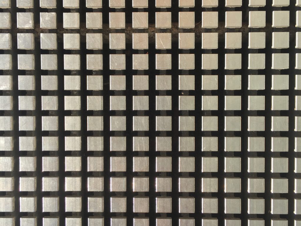 Grid of metallic squares floating over black