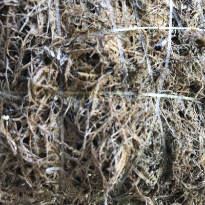 Wiry Mulch with thin strips of clear plastic holding it together