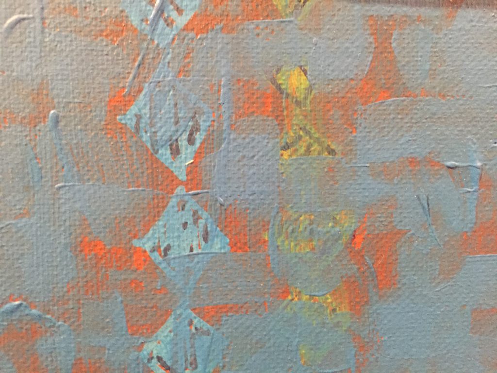 Layered paint with bright orange base covered with blue strokes