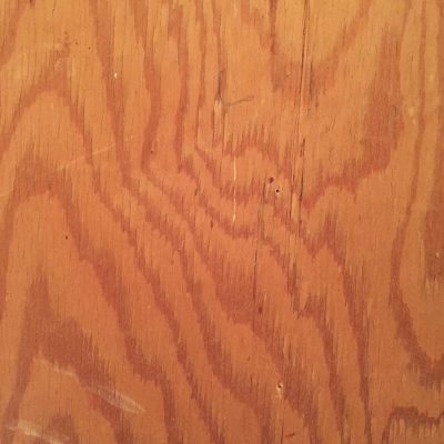 Light red brown plywood with swirling dark tree rings