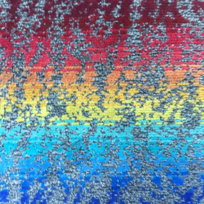 Fractal rainbow gradient color over top of base grey chair upholstery