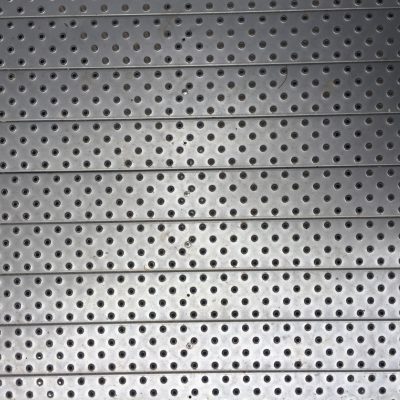 Metallic plate with protruding holes in a diamond pattern