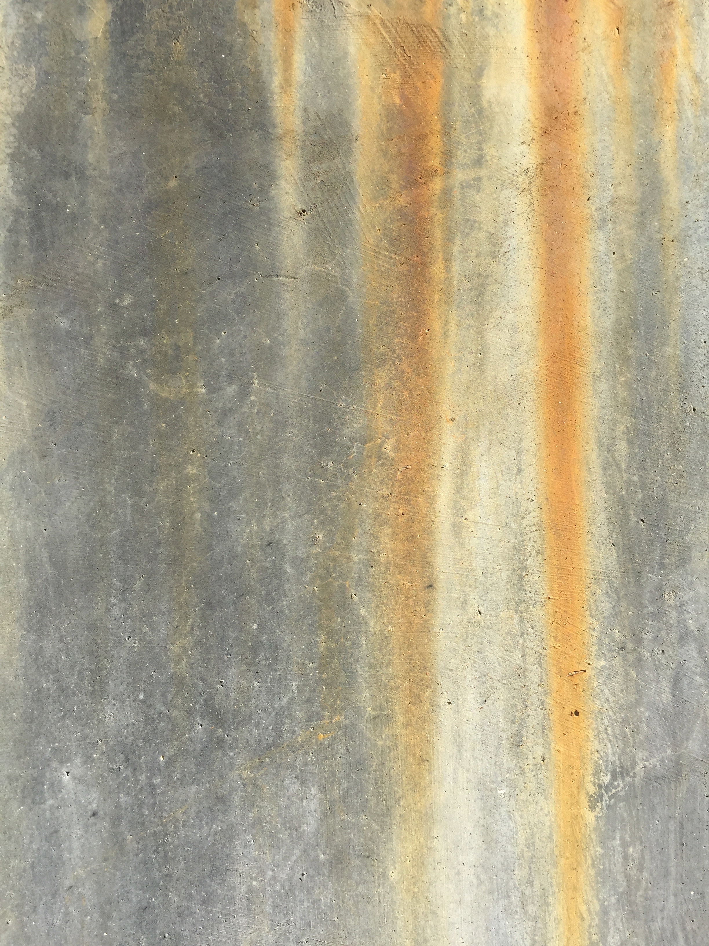 Red rust stains streaking down concrete wall Free Textures