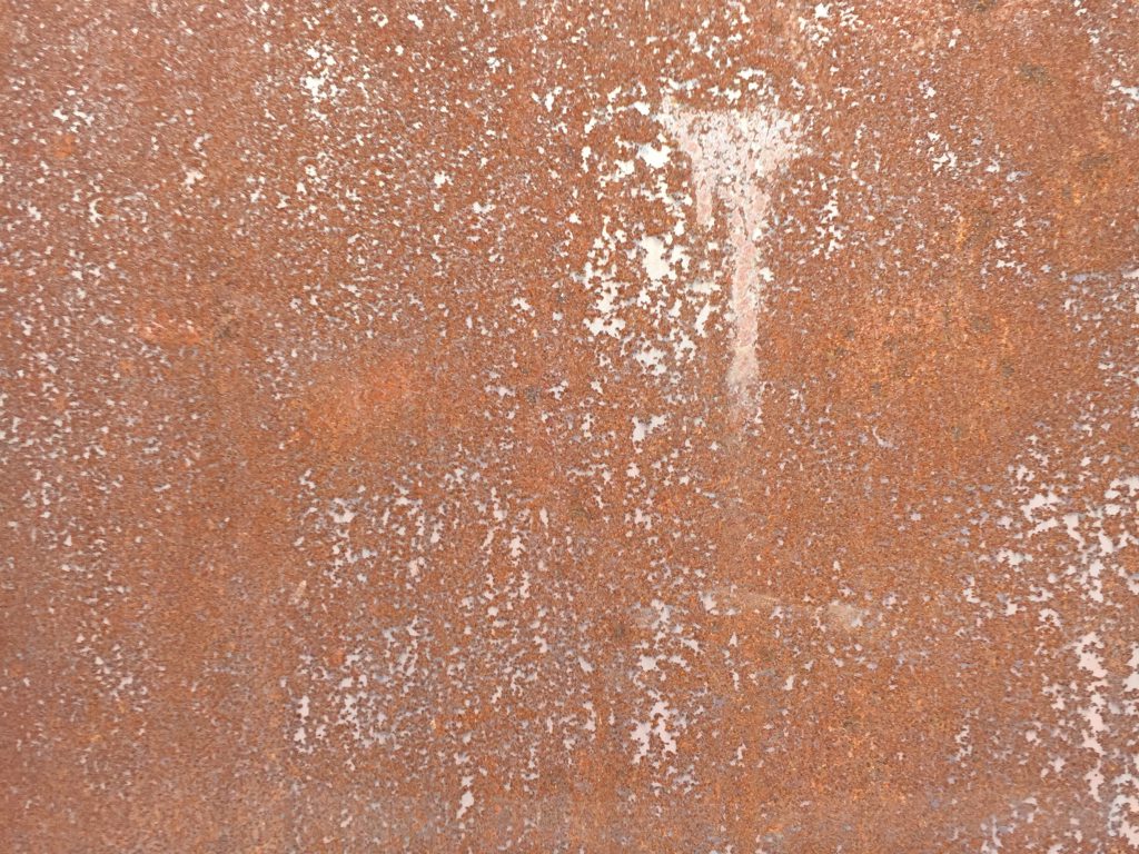 Thin layer of rust covering metal