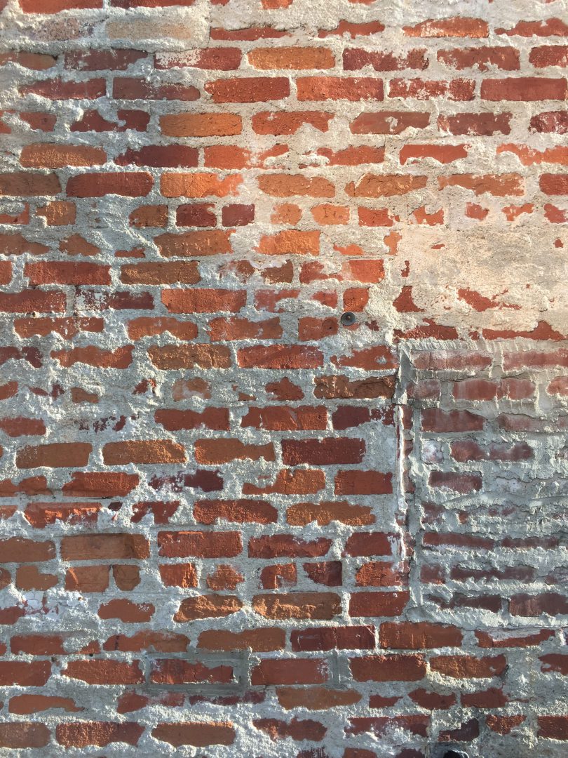 Brick wall with patches and white grout Free Textures