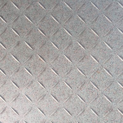Plastic tile with diagonal indents with tiny dotted texture