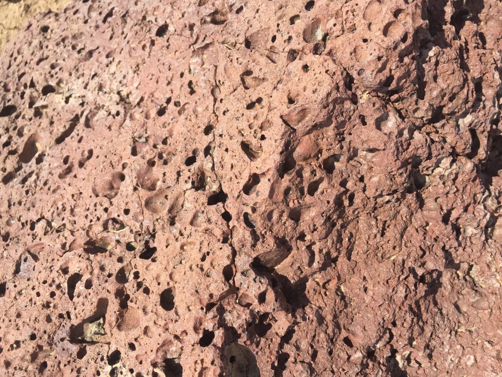 Red lava rocks with holes