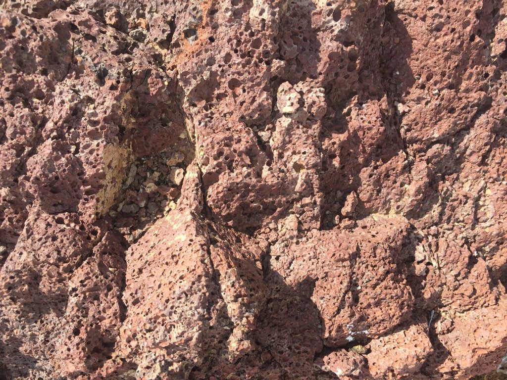 Red lava rocks close up