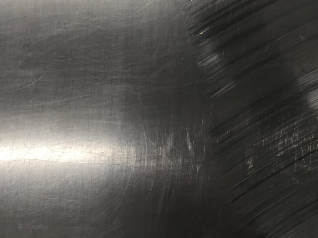 Highlights on shiny metal scuffs and scratches
