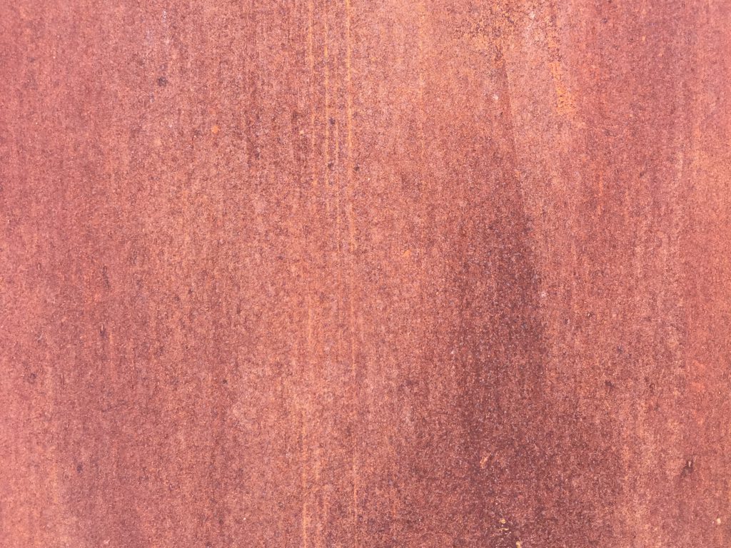 Click here to see High Resolution Image Flakey red rusty metal with fine texture