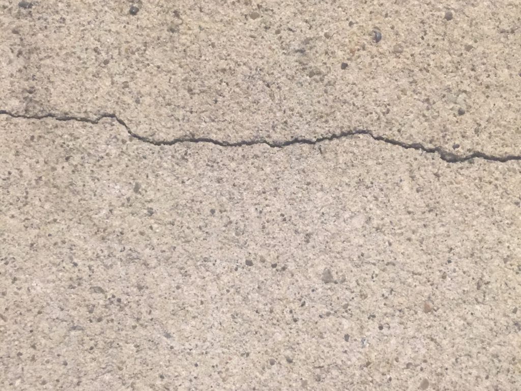 Composite concrete wall with cracks