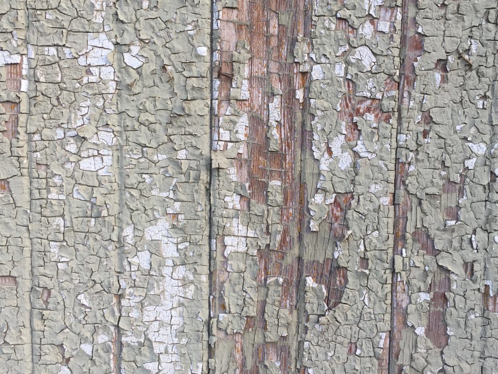 Cracking paint over old wood