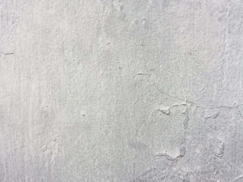 Layers of white paint with scuff marks
