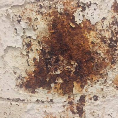 Red rust bleeding through chipping paint