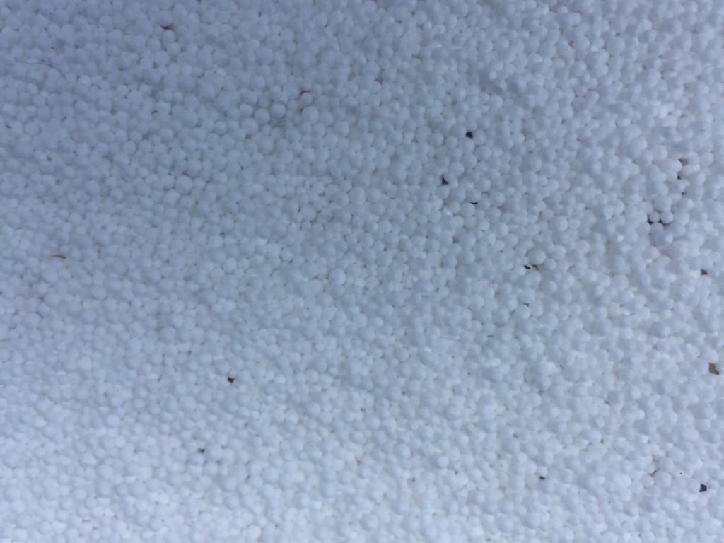 Surface covered in small white balls