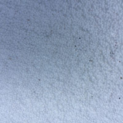 Surface covered in small white balls