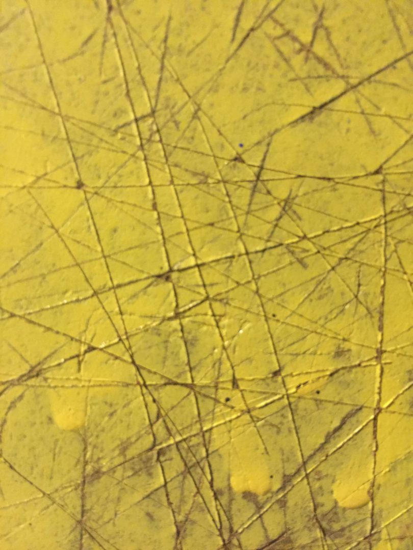 Artboard covered in yellow semigloss paint with score marks Free Textures