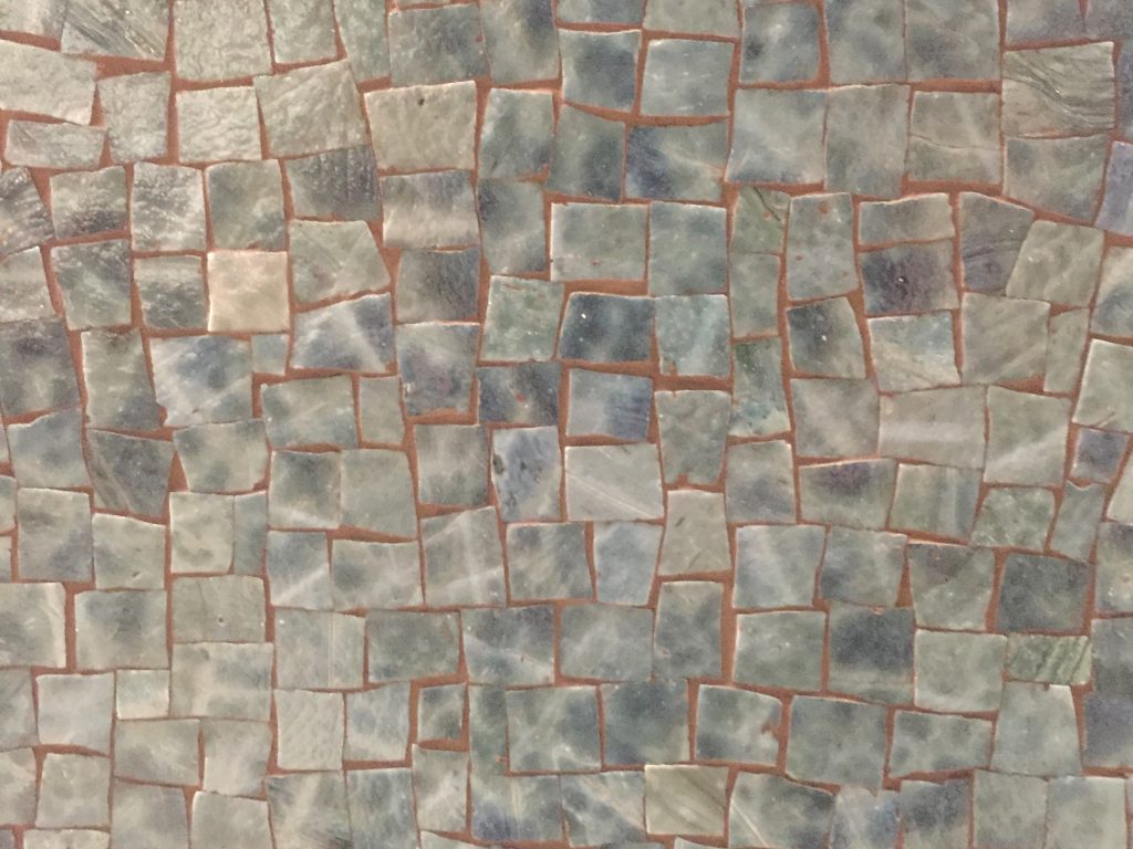 Hand cut tiles in mosaic
